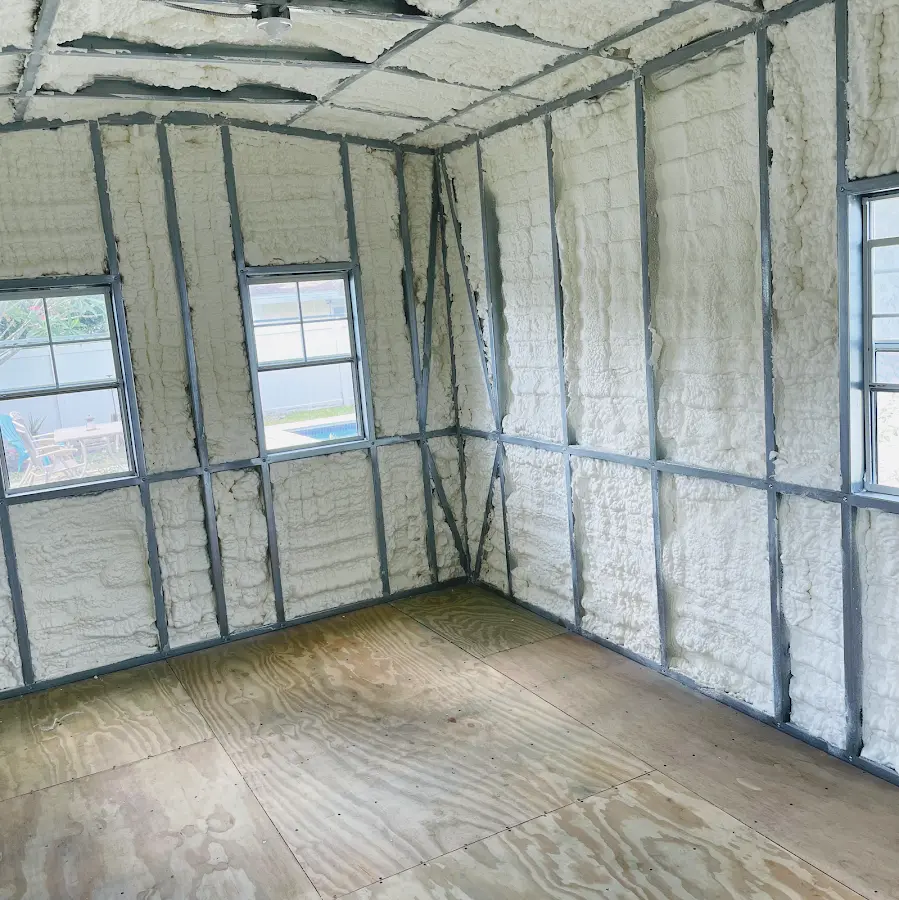 Closed-cell spray foam insulation applied to wall cavities in a residential project in Highwood